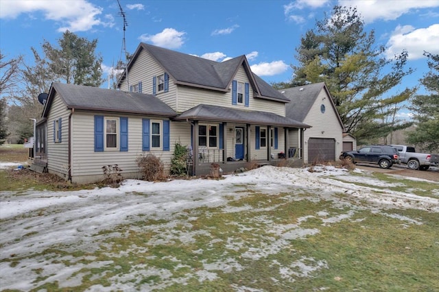 view of front of property featuring an attached garage and covered porch