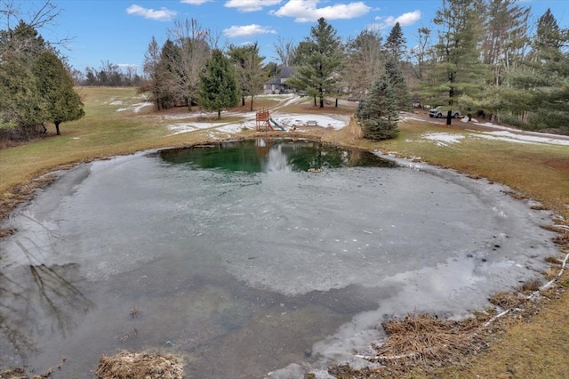 view of swimming pool featuring a water view