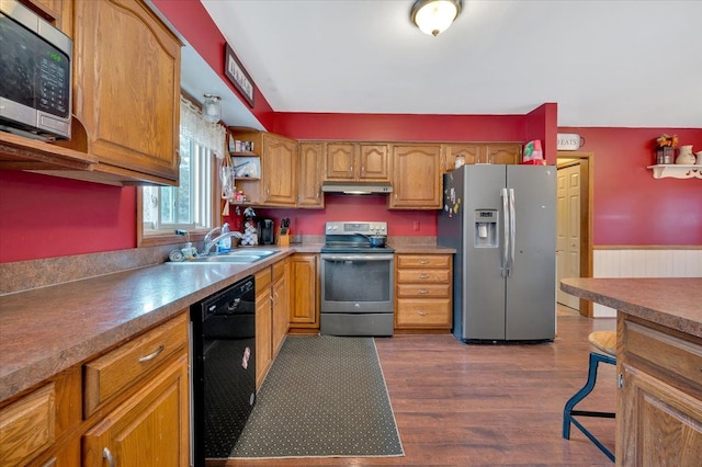 kitchen featuring dark wood-style floors, open shelves, appliances with stainless steel finishes, a sink, and under cabinet range hood