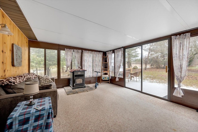 sunroom / solarium with a wood stove