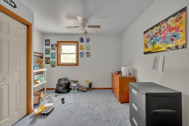 bedroom featuring carpet floors, refrigerator, baseboards, and a ceiling fan