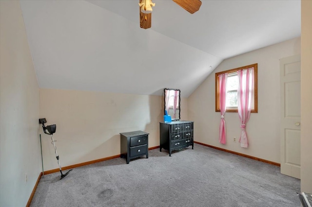 additional living space with lofted ceiling, carpet flooring, a ceiling fan, and baseboards