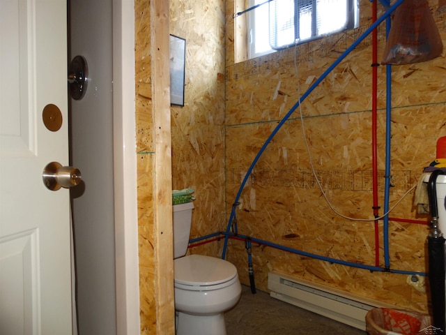 bathroom featuring toilet and a baseboard heating unit