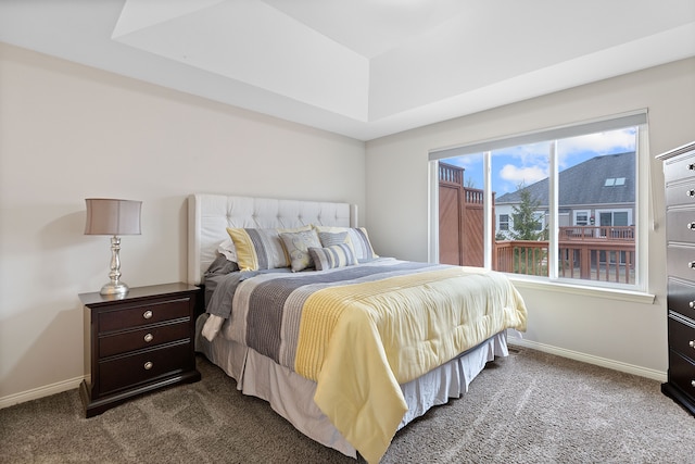 carpeted bedroom featuring baseboards