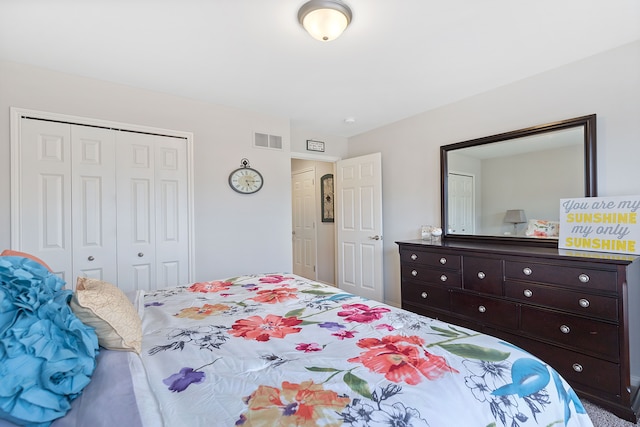 bedroom with visible vents and a closet