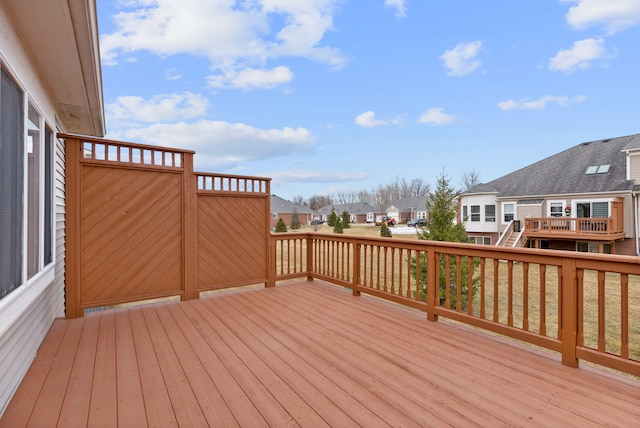 wooden terrace with a residential view