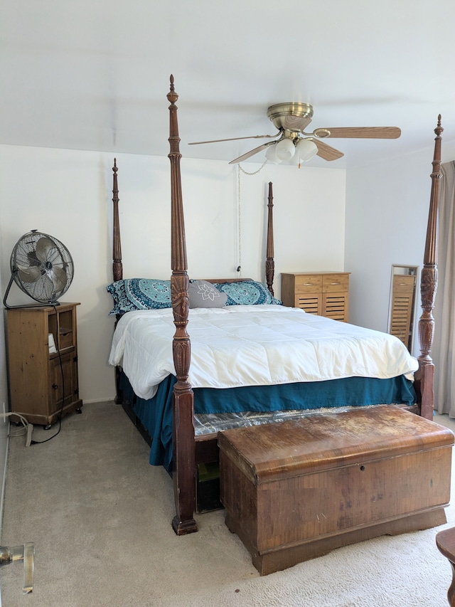 bedroom featuring light carpet and ceiling fan