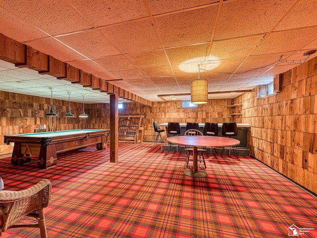 playroom with carpet floors, a paneled ceiling, wood walls, and billiards