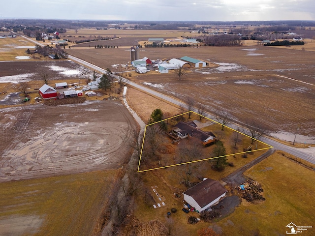 birds eye view of property with a rural view