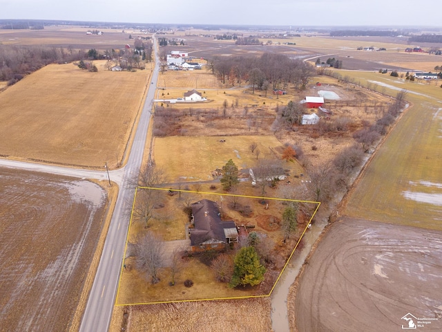 birds eye view of property with a rural view