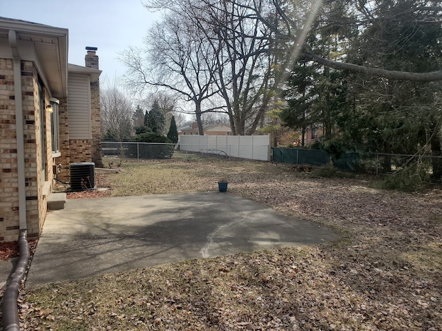 view of patio / terrace featuring fence and central air condition unit