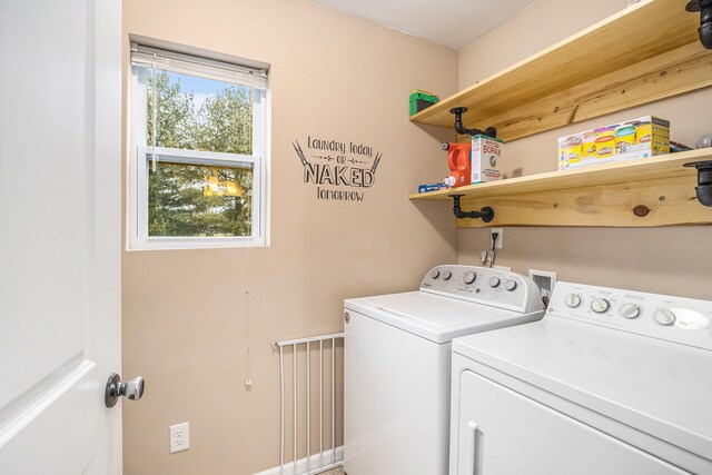 laundry area with laundry area and washer and clothes dryer