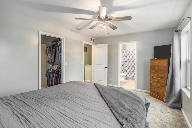 carpeted bedroom with baseboards, ceiling fan, visible vents, and a closet