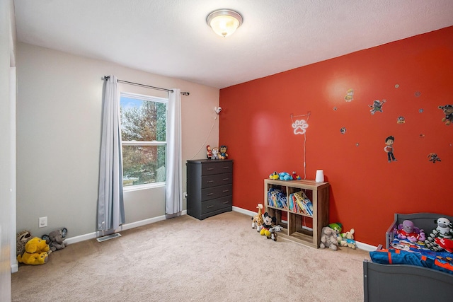 rec room with carpet floors and baseboards