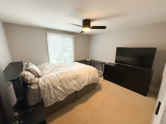 bedroom with ceiling fan and carpet