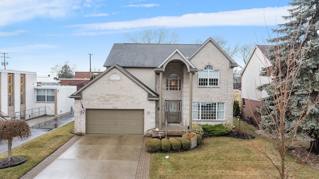 traditional home featuring an attached garage, concrete driveway, brick siding, and a front yard