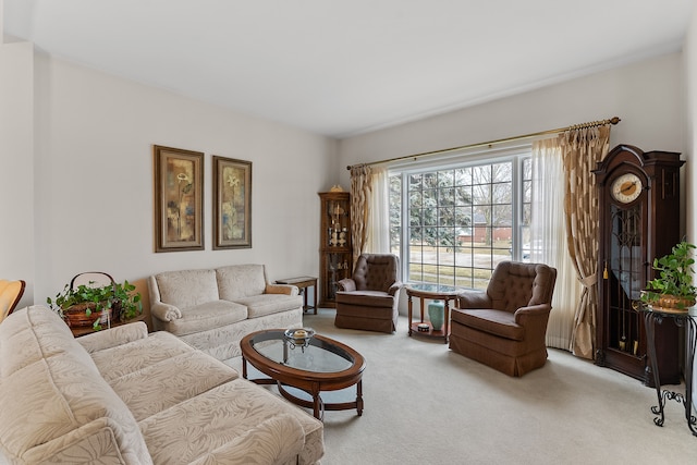 living area featuring light carpet