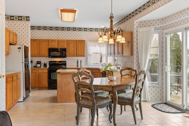 dining area featuring an inviting chandelier, light tile patterned flooring, and wallpapered walls