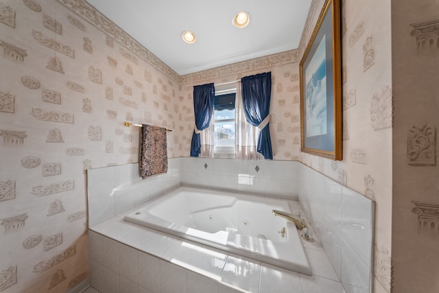 full bath with a whirlpool tub and wallpapered walls