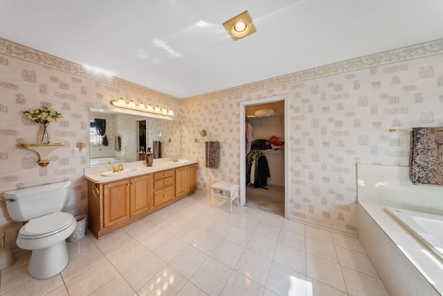 full bath with tiled bath, a sink, toilet, and wallpapered walls