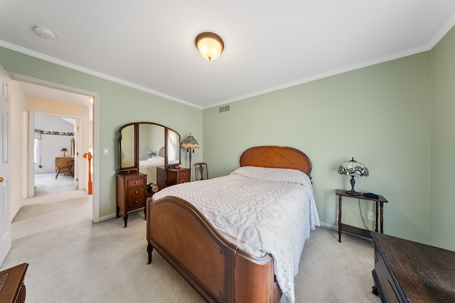 bedroom with visible vents, crown molding, and light colored carpet