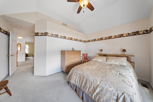 carpeted bedroom with lofted ceiling, ceiling fan, visible vents, and baseboards