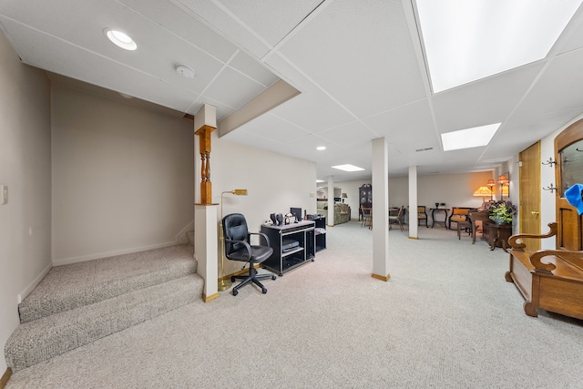 finished basement featuring baseboards, stairway, carpet, a paneled ceiling, and recessed lighting