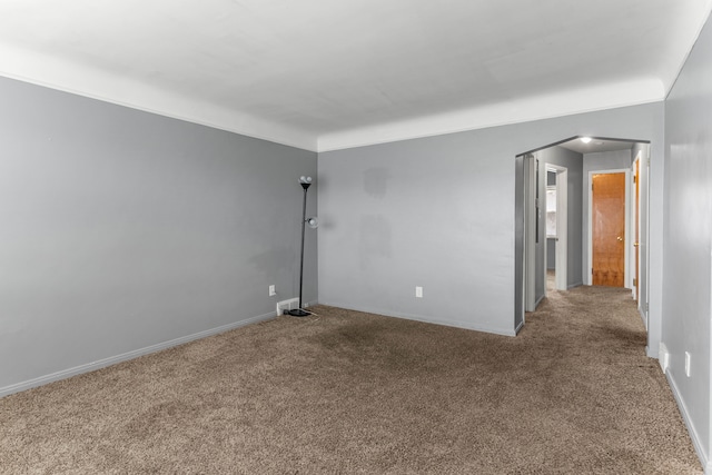 carpeted spare room with baseboards