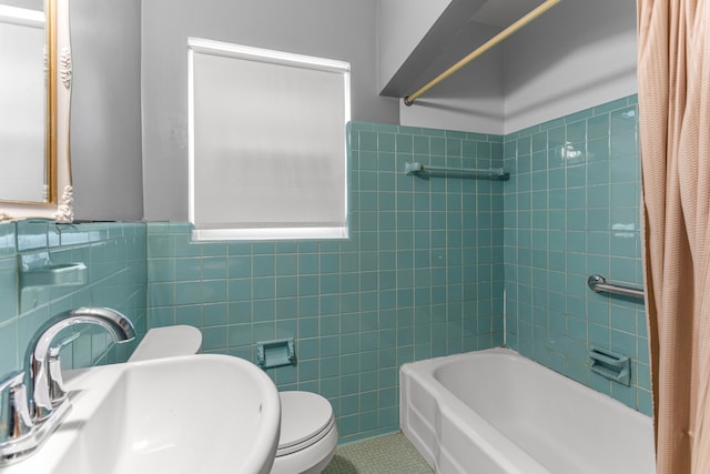 full bathroom with tile patterned flooring, toilet, a sink, tile walls, and shower / tub combo with curtain