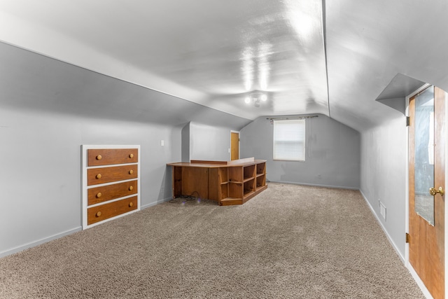 bonus room featuring carpet, visible vents, baseboards, and vaulted ceiling