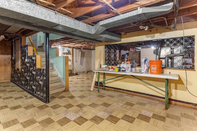 unfinished basement with stairway