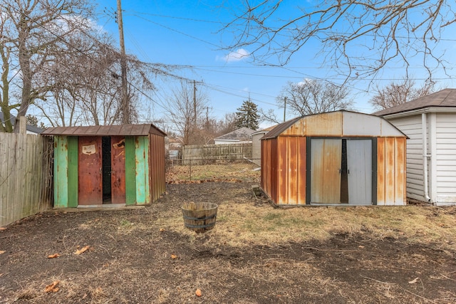 view of shed with a fenced backyard