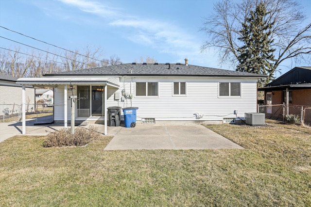 back of property with a yard, a patio area, and fence