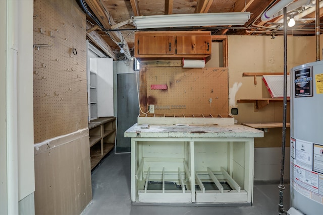 unfinished basement with a workshop area and water heater