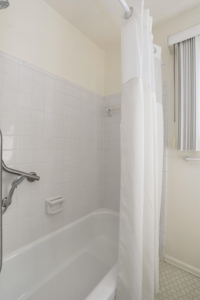 bathroom featuring tile patterned floors and baseboards