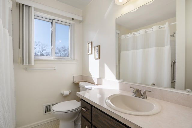 bathroom featuring vanity, baseboards, visible vents, curtained shower, and toilet