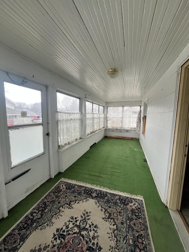 sunroom featuring wooden ceiling