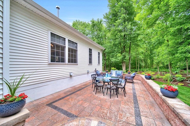 view of patio featuring outdoor dining space