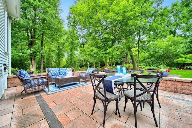 view of patio / terrace featuring an outdoor hangout area and outdoor dining area