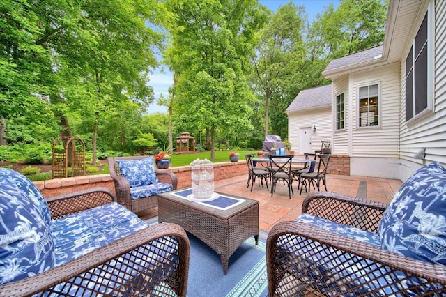 view of patio featuring an outdoor hangout area, outdoor dining area, and a playground