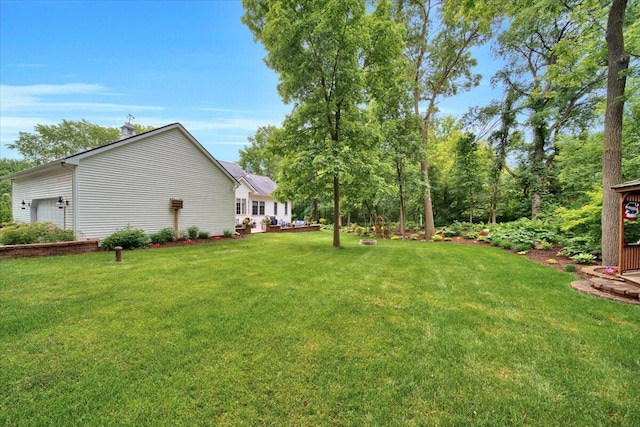 view of yard featuring an attached garage