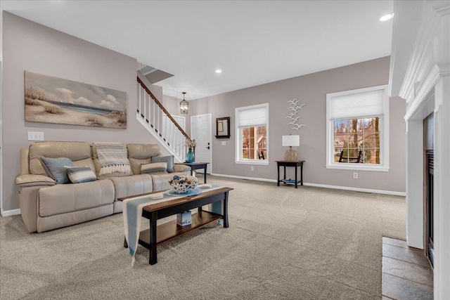 living area with carpet, recessed lighting, baseboards, and stairs