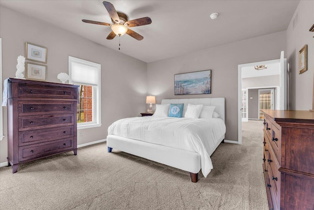 bedroom with a ceiling fan, carpet flooring, visible vents, and baseboards