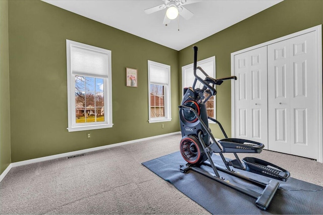 workout area featuring a ceiling fan, carpet flooring, visible vents, and baseboards