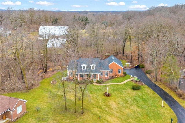 bird's eye view featuring a wooded view