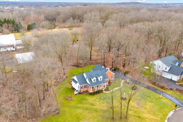 aerial view featuring a wooded view