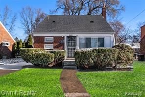 bungalow-style house with a front yard