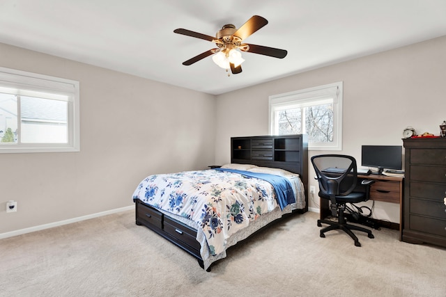 bedroom with ceiling fan, carpet floors, and baseboards