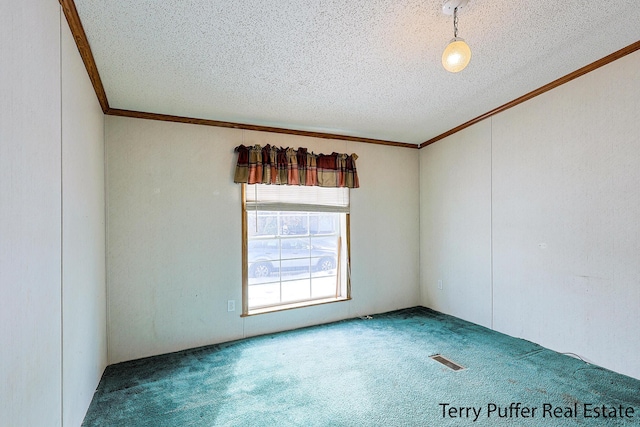 carpeted empty room featuring a textured ceiling, ornamental molding, and visible vents