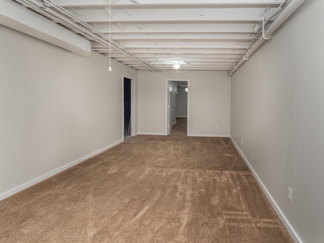 finished basement featuring carpet floors and baseboards